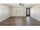Bright living room featuring modern flooring and a view through the glass-paned back door at 319 Thomas Ave, Frostproof, FL 33843
