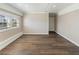 Spacious living room featuring wood-look flooring and bright natural light at 319 Thomas Ave, Frostproof, FL 33843