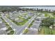 Aerial view of a residential neighborhood with houses, landscaping, and a view of a lake at 3217 La Salle St, Winter Haven, FL 33884