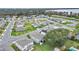 Aerial view of a neighborhood, showcasing well-maintained homes and landscaping with nearby lake at 3217 La Salle St, Winter Haven, FL 33884