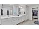 Bright bathroom featuring double vanity, closet and separate toilet room at 3217 La Salle St, Winter Haven, FL 33884