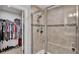 Modern bathroom featuring a walk-in closet, tiled shower and built-in seat at 3217 La Salle St, Winter Haven, FL 33884