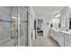 Modern bathroom featuring a glass shower, double vanity, and natural light at 3217 La Salle St, Winter Haven, FL 33884