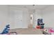 Bedroom featuring a bright window, ceiling fan, carpet, and a door to the bathroom at 3217 La Salle St, Winter Haven, FL 33884