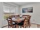 Bright dining room with wooden table and chairs situated near a large window at 3217 La Salle St, Winter Haven, FL 33884