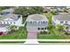 Aerial front elevation of home with manicured lawn, brick driveway and charming curb appeal at 3217 La Salle St, Winter Haven, FL 33884
