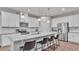 Bright kitchen featuring a granite countertop island with bar stool seating and stainless steel appliances at 3217 La Salle St, Winter Haven, FL 33884
