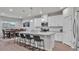 Bright kitchen with granite countertops, stainless steel appliances, white cabinets and bar stool seating at island at 3217 La Salle St, Winter Haven, FL 33884