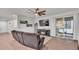 Cozy living room featuring a fireplace, hardwood floors, ceiling fan, and patio access at 3217 La Salle St, Winter Haven, FL 33884