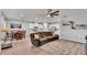 Open-concept living area connects to kitchen and dining areas featuring hardwood floors and contemporary decor at 3217 La Salle St, Winter Haven, FL 33884