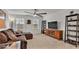 Inviting living room features a comfortable sectional sofa, entertainment center, and ample natural light at 3217 La Salle St, Winter Haven, FL 33884