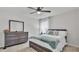 Bright main bedroom featuring a ceiling fan, dresser and a large bed at 3217 La Salle St, Winter Haven, FL 33884