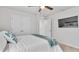 Bright main bedroom featuring a ceiling fan, large windows and access to closets at 3217 La Salle St, Winter Haven, FL 33884