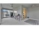 Covered patio with ceiling fans, outdoor seating and large sliding glass doors leading to the interior at 3217 La Salle St, Winter Haven, FL 33884