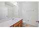 Bright bathroom featuring a large mirror, tile flooring, and a clean, modern aesthetic at 336 Summer Squall Rd, Davenport, FL 33837