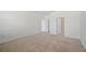 Spacious bedroom with carpet, neutral walls, and closet at 336 Summer Squall Rd, Davenport, FL 33837