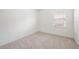 Bedroom featuring natural light, carpet flooring, and neutral walls and trim at 336 Summer Squall Rd, Davenport, FL 33837