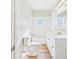 Bathroom featuring a shower-tub combo, white tile, and white vanity at 3736 Knights Station Rd, Lakeland, FL 33810