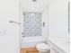 Stylish bathroom featuring decorative shower tile and a white vanity at 3736 Knights Station Rd, Lakeland, FL 33810