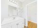Bathroom features a spacious vanity with storage and a well-lit mirror at 3736 Knights Station Rd, Lakeland, FL 33810