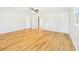 Bright bedroom features vinyl flooring, closet, and three entry doors at 3736 Knights Station Rd, Lakeland, FL 33810