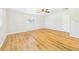 Bright bedroom with wood-look floors, a window, and a ceiling fan at 3736 Knights Station Rd, Lakeland, FL 33810