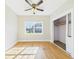Bright bedroom with hardwood floors and large window providing natural light at 3736 Knights Station Rd, Lakeland, FL 33810