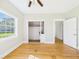 Bedroom featuring closet, a large window with a view, and hardwood floors at 3736 Knights Station Rd, Lakeland, FL 33810