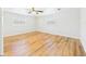 Bedroom with vinyl flooring, two windows, and neutral walls at 3736 Knights Station Rd, Lakeland, FL 33810