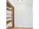Walk-in closet with shelving, vinyl floor and white walls at 3736 Knights Station Rd, Lakeland, FL 33810