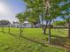 Charming single-story home with a fenced yard and mature tree providing shade at 3736 Knights Station Rd, Lakeland, FL 33810