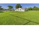 Quaint single-story home featuring a well-manicured lawn and a classic white exterior at 3736 Knights Station Rd, Lakeland, FL 33810