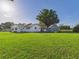 Wide lawn view of a charming home featuring a shed at 3736 Knights Station Rd, Lakeland, FL 33810