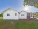 Exterior view showcasing the side of the home and porch at 3736 Knights Station Rd, Lakeland, FL 33810