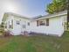 Side exterior showcasing the well-maintained lawn at 3736 Knights Station Rd, Lakeland, FL 33810