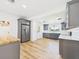 Bright kitchen with stainless appliances and stylish gray cabinetry at 3736 Knights Station Rd, Lakeland, FL 33810