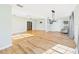 Spacious living room with updated flooring, modern lighting, and ample natural light at 3736 Knights Station Rd, Lakeland, FL 33810