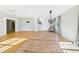 Inviting living space featuring hardwood floors, a modern chandelier, and neutral paint at 3736 Knights Station Rd, Lakeland, FL 33810