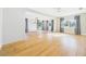 Bright living room with hardwood floors, a stylish chandelier, and large windows at 3736 Knights Station Rd, Lakeland, FL 33810