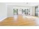Inviting living space featuring hardwood floors, modern lighting, and ample space at 3736 Knights Station Rd, Lakeland, FL 33810