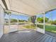 Peaceful screened porch with views of the neighborhood at 3736 Knights Station Rd, Lakeland, FL 33810