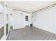 Enclosed porch with screen windows and outdoor access at 3736 Knights Station Rd, Lakeland, FL 33810