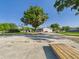 This property contains an oversized concrete parking area, large trees, and several detached buildings at 3736 Knights Station Rd, Lakeland, FL 33810