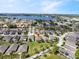 An aerial view of a lakeside residential area, featuring well-maintained homes and beautiful scenery at 3905 Osprey Pointe Cir, Winter Haven, FL 33884
