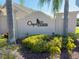A well-maintained community entrance sign with lush greenery and an inviting atmosphere at 3905 Osprey Pointe Cir, Winter Haven, FL 33884