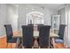 Well-lit dining room features hardwood floors and elegant decor at 3905 Osprey Pointe Cir, Winter Haven, FL 33884