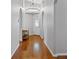 Elegant hallway with hardwood floors and decorative lighting at 3905 Osprey Pointe Cir, Winter Haven, FL 33884