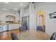 Open-concept kitchen with granite countertops and stainless steel appliances at 3905 Osprey Pointe Cir, Winter Haven, FL 33884