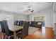 Open-concept living room features hardwood floors, high ceilings, and lots of natural light at 3905 Osprey Pointe Cir, Winter Haven, FL 33884