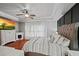 Main bedroom features hardwood floors, decorative ceiling fan, and lots of natural light at 3905 Osprey Pointe Cir, Winter Haven, FL 33884